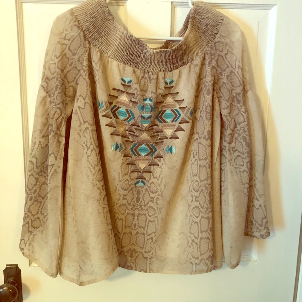 Beautiful Flowy off the shoulder blouse.